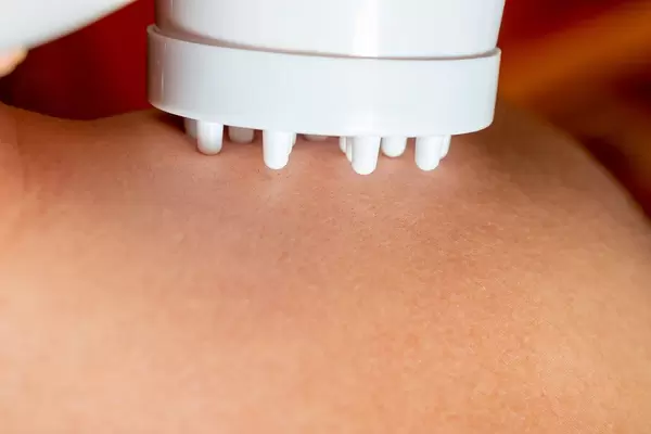 Massager for massage with heating at the shoulder