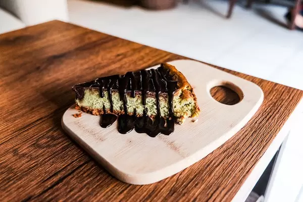 Matcha cheesecake on wooden table (Flip 2019)