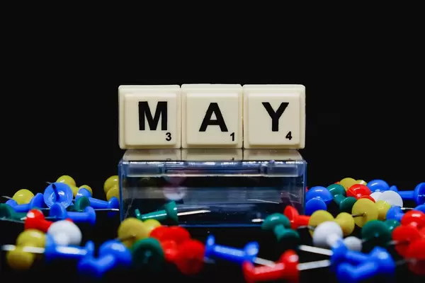 May text with pins on foreground