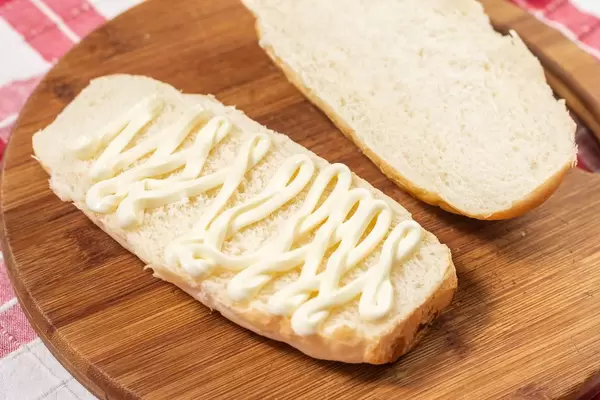 Mayonnaise with Bread on the wooden board