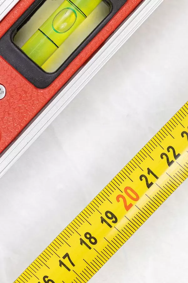 Measuring Tape with Level in Construction Concept with copy space