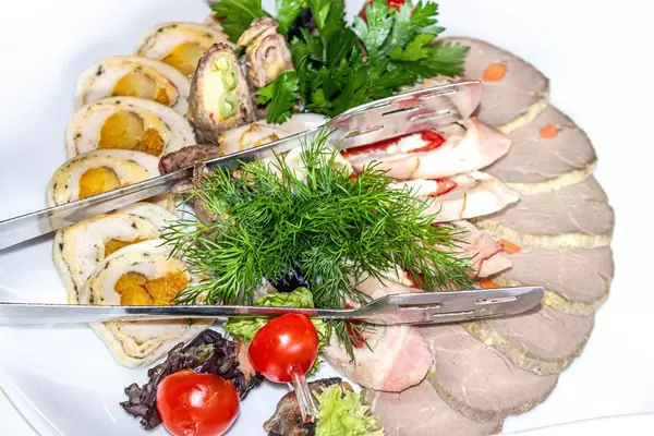 Meat rolls with dried apricots, vegetables, baked sliced meat and fresh herbs (Flip 2019)