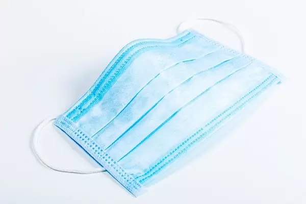 Medical blue mask on a white background