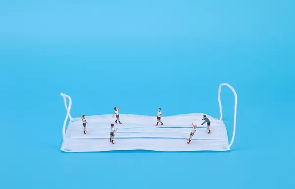 Medical face mask and football players