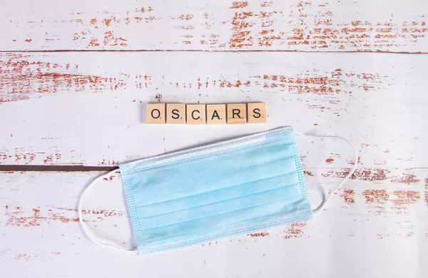 Medical face mask and Oscars text on wooden blocks