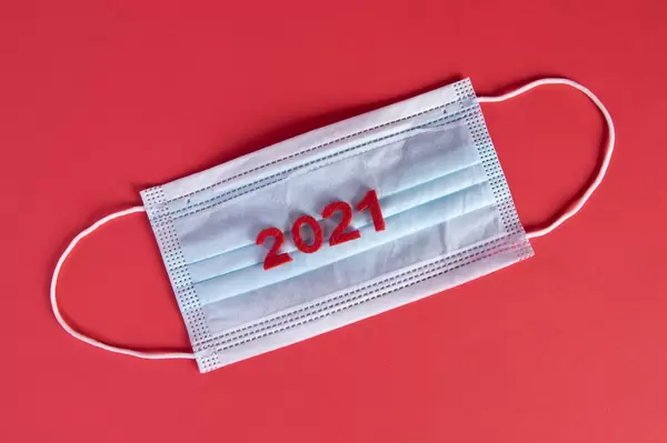 Medical face mask with 2021 text on red background