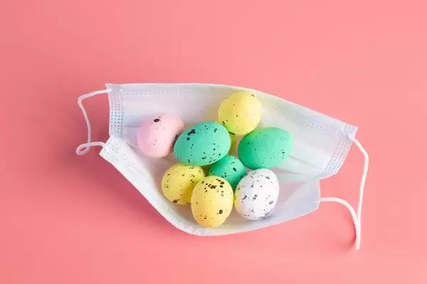 Medical protective face mask and colorful easter eggs