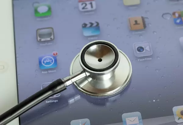 Medical stethoscope on modern digital tablet