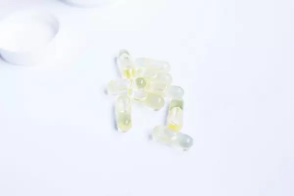Medicine capsules on white background