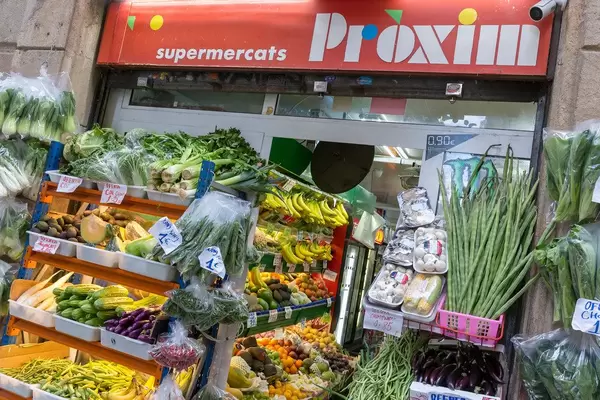 Mediterranean fruits and vegetables at the Spanish supermarket "Proxim" in a corner shop style at the street Carrer de Joaquín Costa in Barcelona