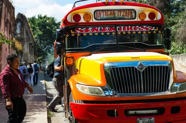 Men getting on a typical Guatemalan bus