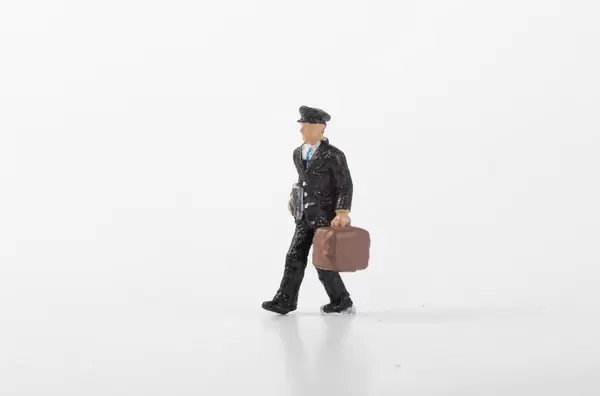 Men with suitcase toy on white background
