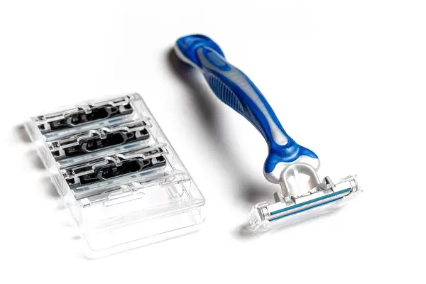 Men's razor with blades on a white background