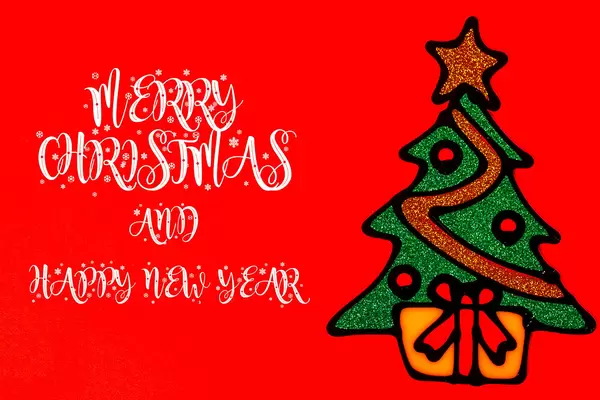 Merry Christmas and happy new year greeting card with Christmas tree on red background