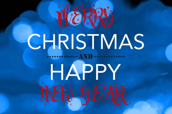 Merry Christmas and Happy new year on blurred blue bokeh