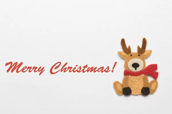 Merry Christmas Schriftzug mit einem Rentier