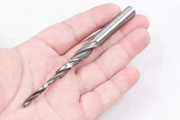 Metal Drill for woodworking on the palm of the hand