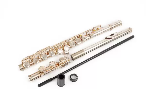 Metal Flute parts above white background