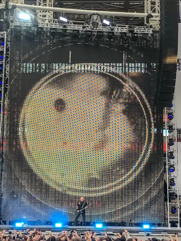 Metallica perform in front of a big screen and give a rock concert in Cologne during their 2019 tour