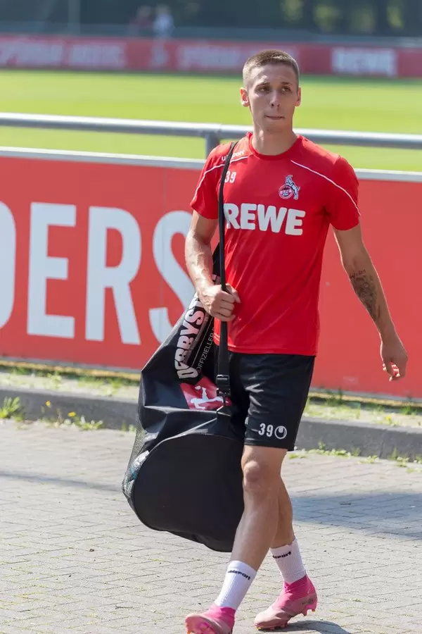 Midfielder Darko Churlinov walks with packed bag after team training at the clubhouse of FC Cologne, Germany