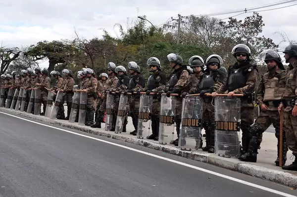 Military Police Officers standing on the Side of Street at World Cup 2014 in Brazil with full Equipment