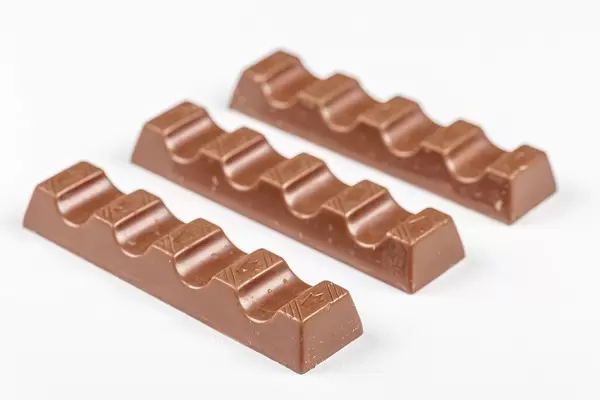Milk chocolate candies on a white background (Flip 2020)