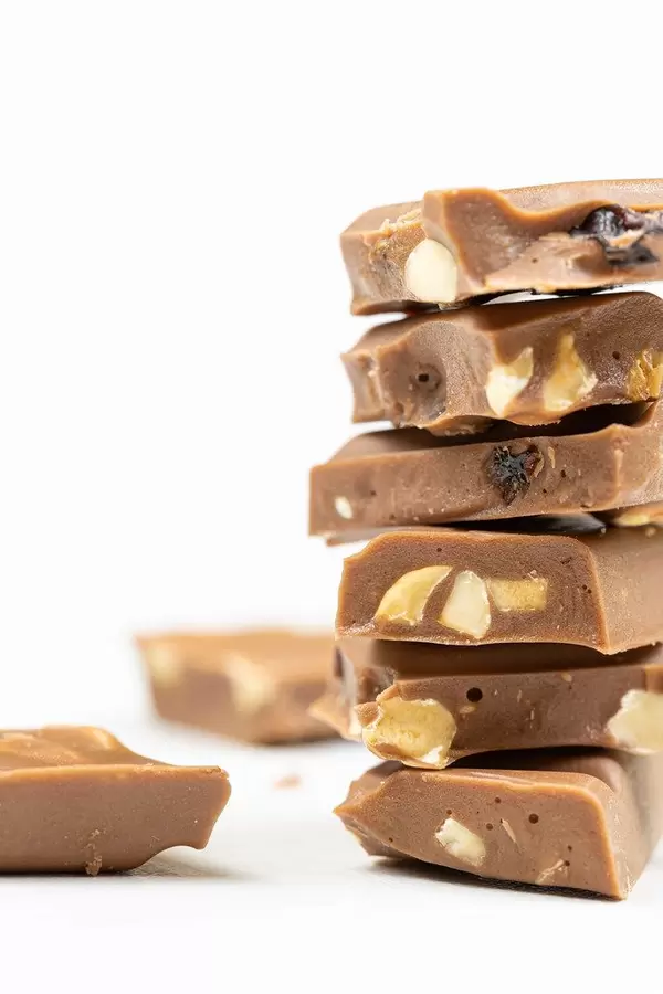 Milka Chocolate bars stacked on the white table