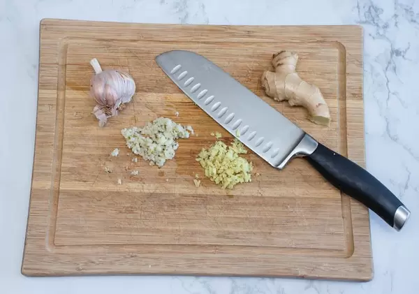 Minced Garlic and Ginger  in a wooden Chopping Board  (Flip 2019)