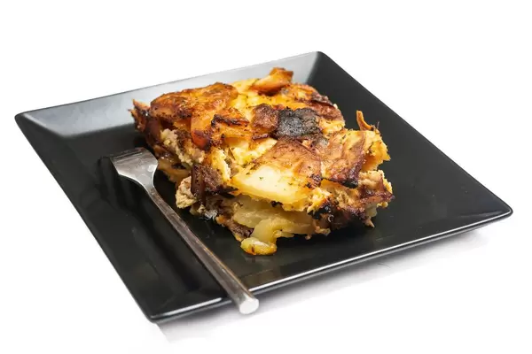 Minced meat moussaka isolated over white background