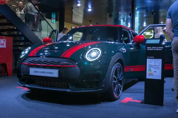 MINI Car Clubman John Cooper Works in Rebel Green with red roof and stripes
