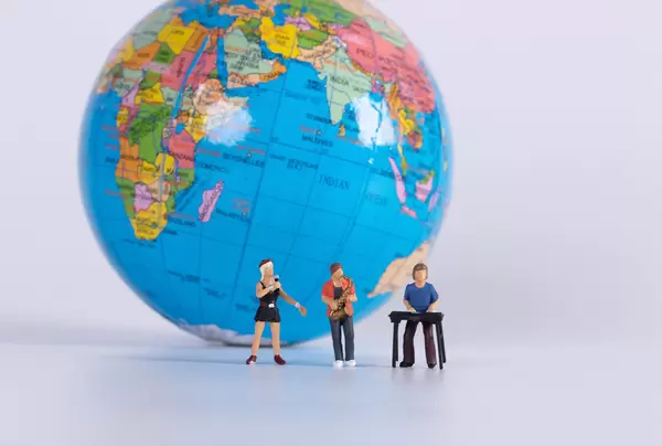 Miniature band with globe in the background