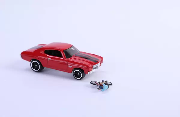 Miniature cyclist who crashed with red car