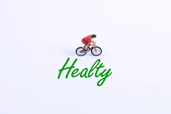 Miniature cyclist with Healty text