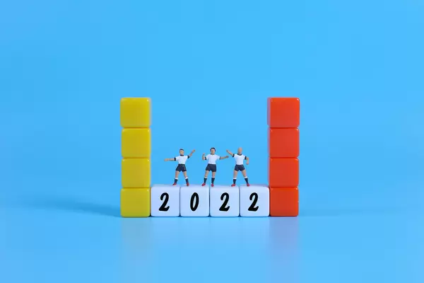Miniature football players on blocks with 2022 text