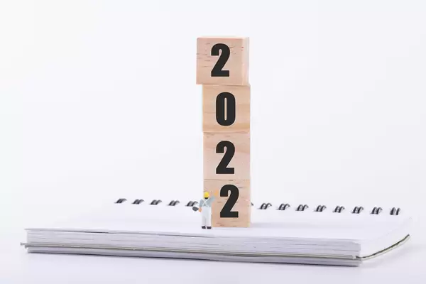 Miniature painter and wooden blocks with 2022 text