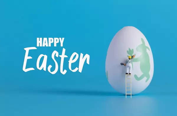 Miniature painter painting easter egg and Happy Easter text