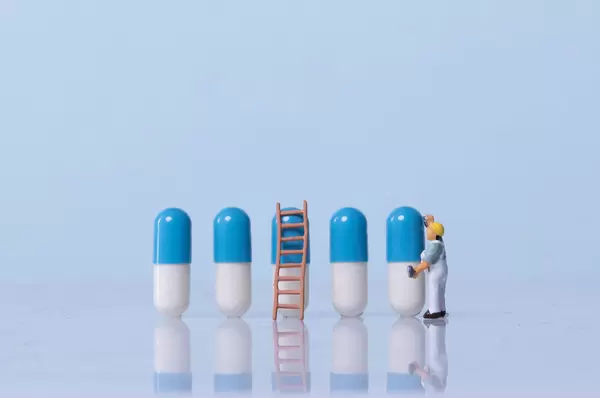 Miniature painter painting pills