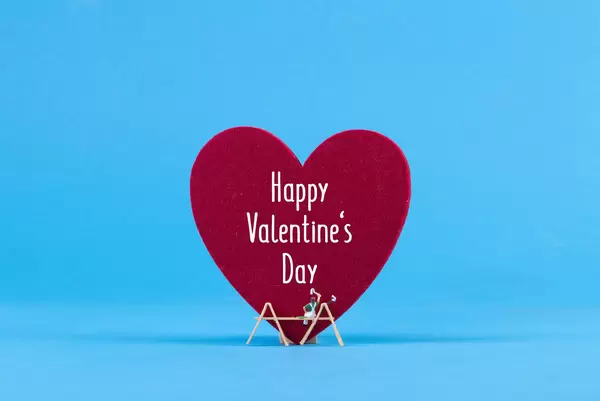 Miniature painter with big red heart and Happy Valentine's Day text