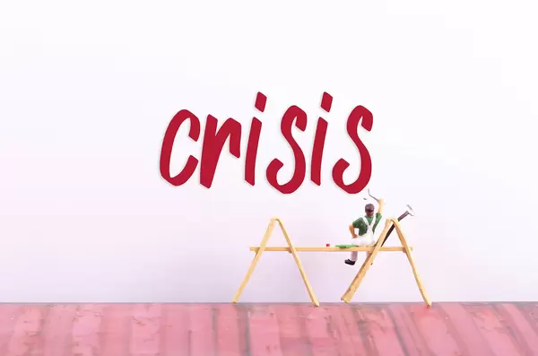 Miniature painter with Crisis text