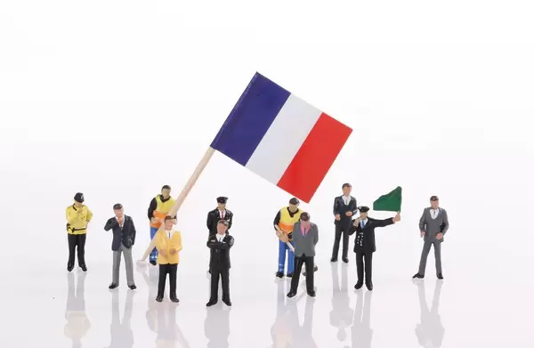 Miniature people with flag of France
