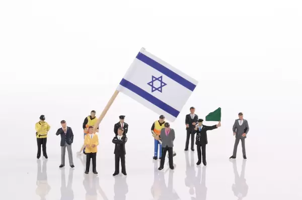Miniature people with flag of Israel