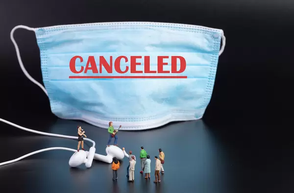 Miniature rock band and medical face mask with Canceled text