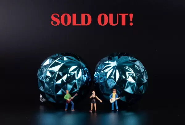 Miniature rock band with Sold out text