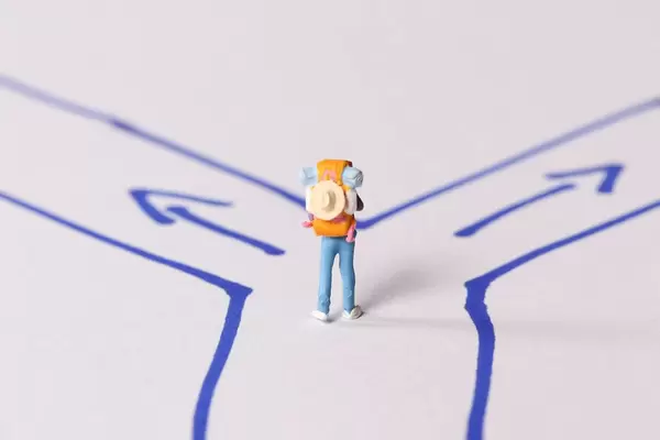 Miniature traveler walking on the path