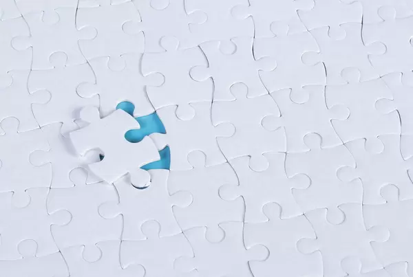 Missing puzzle piece on blue background