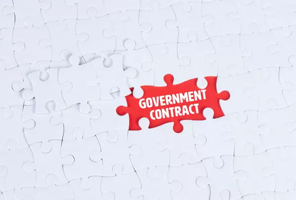Missing puzzle pieces with a Fake Government Contract text