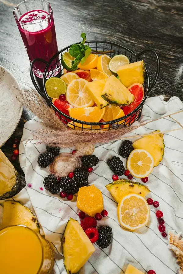 Mix Of Citrus Fruit Bowl And Blackberry Smoothie