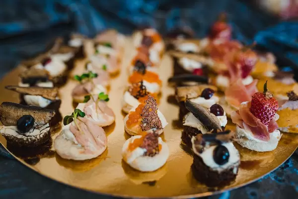 Mix Of Luxury Gourment Canapes With Herring, Cream, Fish Eggs And Prosciutto
