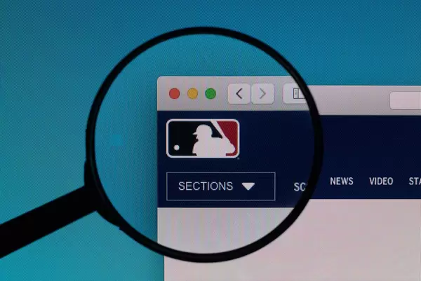 MLB.com logo under magnifying glass