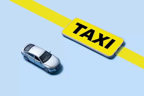 Mobile application of taxi service and miniature business class auto model